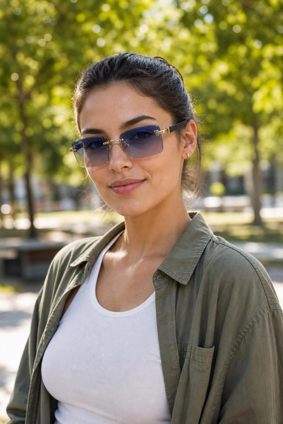 Grove Rimless Sunglasses worn in a sunny park