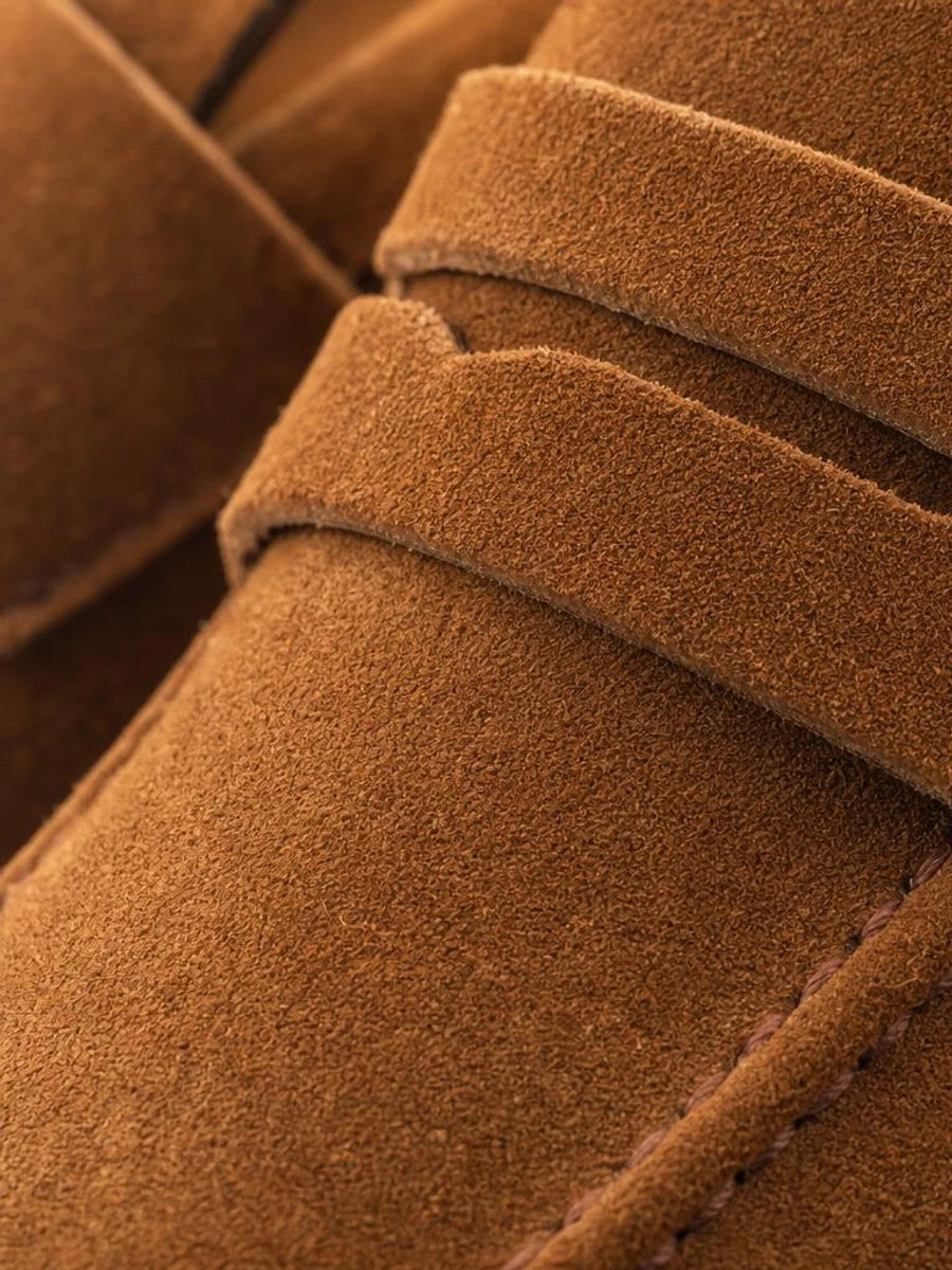 Matte suede that catches light instead of shining