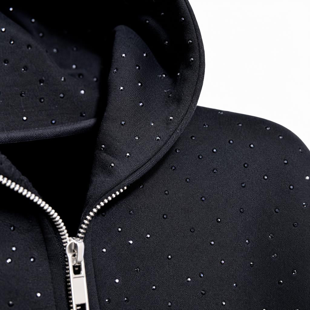 Detalle de la textura de brillos y cierre del Stardust Hoodie